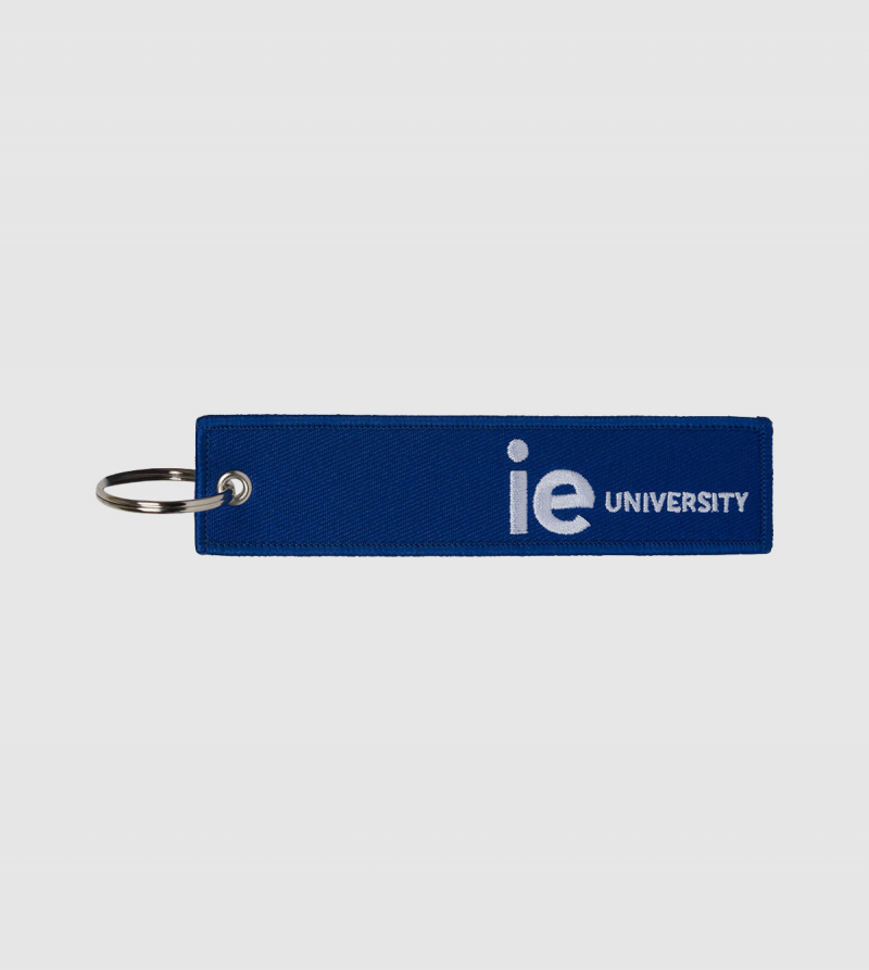 IE University Embroidery Keychain. Blue color front